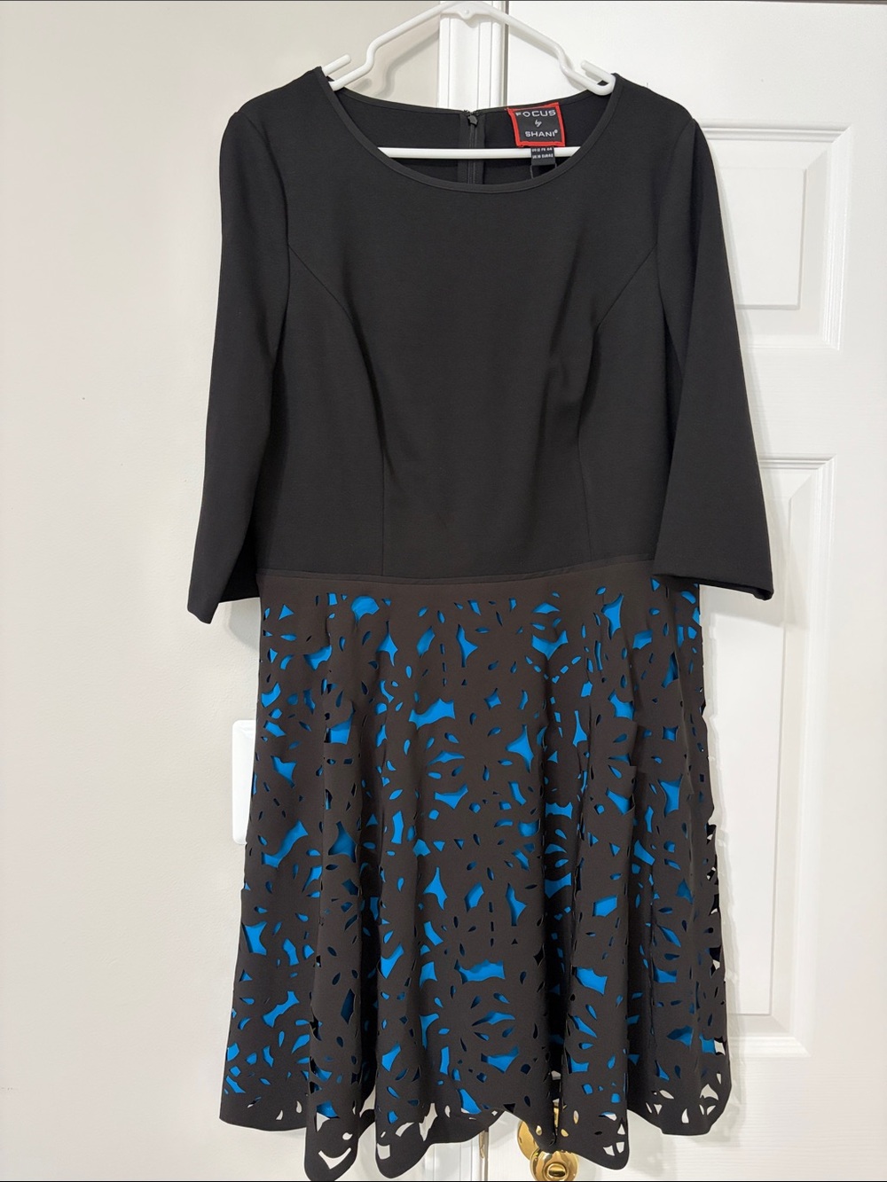 Focus by Shani Black Dress with Blue Laser-Cut Skirt